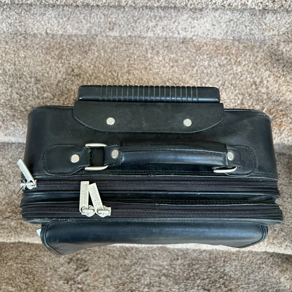 Wilson’s Black Leather Carry on Luggage.